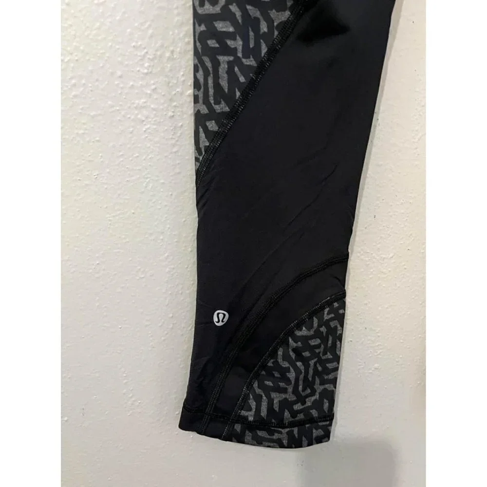 Lululemon Black net Print Run Inspire Crop II Block it Pocket Leggings Size 6